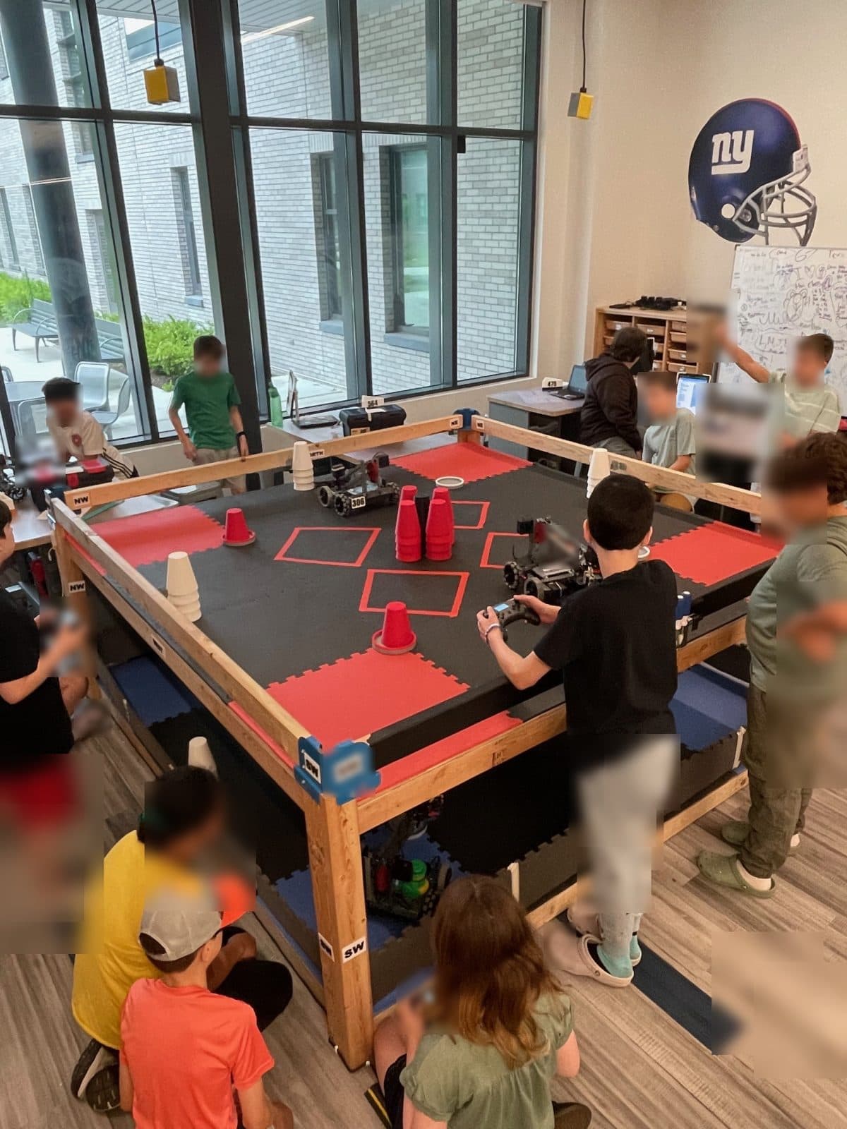 A student driving their robot with a controller