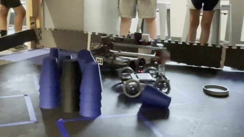 A robot scoring blue cups